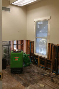 Wall and floor damage to the Checchi House caused by flooding from Hurricane Matthew