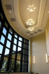 Atrium ceiling of Southpoint Surgery Center with large windows and elegant light fixtures