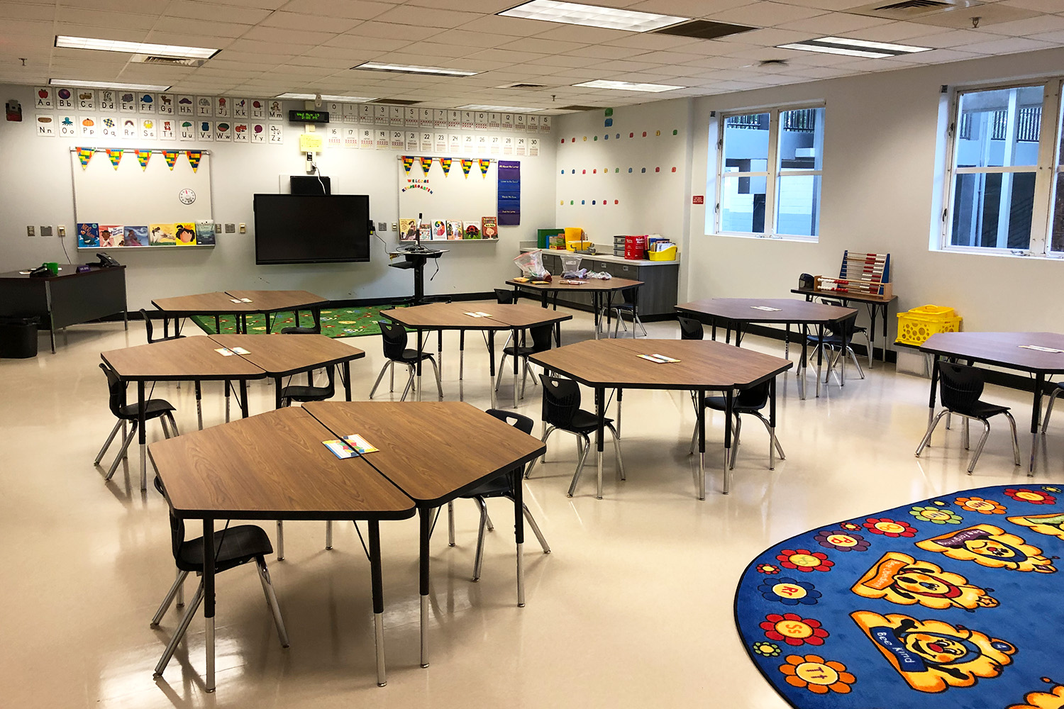 Elementary school classroom with desks and chairs