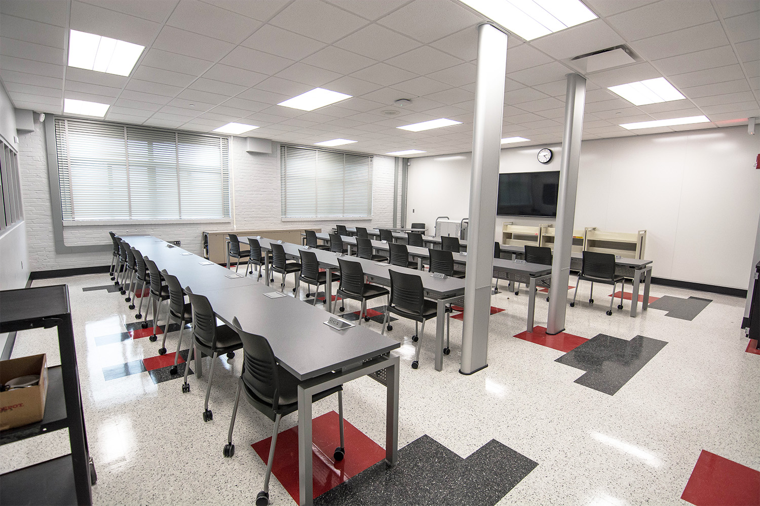 Cyber security classroom with desks, chairs and power supply outlets in the desks